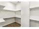 Walk-in pantry with wooden floor and white shelves at 1015 Churchman Ave, Indianapolis, IN 46203