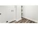 Well-lit storage area featuring sleek, dark wood-look flooring and functional shelving at 1015 Churchman Ave, Indianapolis, IN 46203