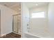 Bright bathroom featuring soaking tub and a shower with glass door at 1105 Gatewick Ct, Greenwood, IN 46143