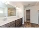 Bathroom featuring double sink vanity with modern fixtures and shower with glass doors at 1105 Gatewick Ct, Greenwood, IN 46143