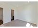 Comfortable bedroom with neutral carpet, direct access to the bathroom, and natural light at 1105 Gatewick Ct, Greenwood, IN 46143