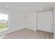 Bright bedroom features neutral carpet, a double closet, and a window with a green view at 1105 Gatewick Ct, Greenwood, IN 46143