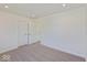 Bedroom featuring plush carpets and white doors for closet and hallway access at 1105 Gatewick Ct, Greenwood, IN 46143
