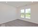 Well lit bedroom offering neutral colored walls and plush carpets at 1105 Gatewick Ct, Greenwood, IN 46143