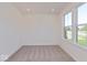 Cozy bedroom with neutral carpet and a large window overlooking the neighborhood at 1105 Gatewick Ct, Greenwood, IN 46143