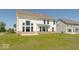 Rear exterior elevation showcasing beautiful architecture and landscaping around the home at 1105 Gatewick Ct, Greenwood, IN 46143