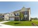 Charming home showcasing a well-manicured lawn, brick facade, and an attached two car garage at 1105 Gatewick Ct, Greenwood, IN 46143