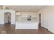 Bright, open kitchen with an island, white cabinets, and stainless steel appliances at 1105 Gatewick Ct, Greenwood, IN 46143