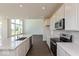 Open-concept kitchen with stainless steel appliances, a center island, and natural light at 1105 Gatewick Ct, Greenwood, IN 46143