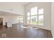 Bright living room features hardwood floors, and expansive windows that offer views of the surrounding neighborhood at 1105 Gatewick Ct, Greenwood, IN 46143