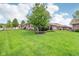 Beautiful brick home with a lush green backyard and mature tree that offers plenty of space at 5707 Kensington Blvd, Plainfield, IN 46168