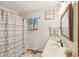 Bathroom with a neutral color scheme featuring a patterned shower curtain and a white countertop at 5707 Kensington Blvd, Plainfield, IN 46168