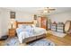 Bright bedroom with hardwood floors, comfortable bed and stylish rugs at 5707 Kensington Blvd, Plainfield, IN 46168