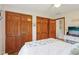 Bedroom featuring hardwood floors, closet space, and TV on a dresser at 5707 Kensington Blvd, Plainfield, IN 46168