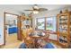 Cozy dining room with natural lighting, with hardwood floors and access to the kitchen at 5707 Kensington Blvd, Plainfield, IN 46168