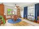 Dining room with hard wood floors, lots of natural light and a blue accent rug at 5707 Kensington Blvd, Plainfield, IN 46168