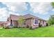 Beautiful brick home featuring lush landscaping, a well-manicured lawn, and charming curb appeal at 5707 Kensington Blvd, Plainfield, IN 46168