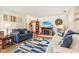 Cozy living room with a fireplace, comfortable seating, and stylish decor at 5707 Kensington Blvd, Plainfield, IN 46168