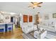 Bright living room featuring hardwood floors and comfortable seating with access to other rooms at 5707 Kensington Blvd, Plainfield, IN 46168