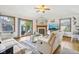Inviting living room with a cozy fireplace, wood floors, and sliding door access to outdoor space at 5707 Kensington Blvd, Plainfield, IN 46168