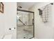 Modern shower with glass door, built-in seat, and rainfall shower head provides a spa-like experience at 5707 Kensington Blvd, Plainfield, IN 46168