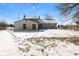 Backyard featuring the home's elevation and snowy landscaping at 5060 Staughton Dr, Indianapolis, IN 46226