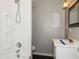 Bathroom featuring a shower and tub combo, updated vanity and fixtures at 5060 Staughton Dr, Indianapolis, IN 46226