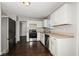Modern kitchen featuring stainless steel appliances, white cabinets, and hardwood floors at 5060 Staughton Dr, Indianapolis, IN 46226