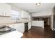 Well-equipped kitchen with modern stainless steel appliances, white cabinets, and open layout at 5060 Staughton Dr, Indianapolis, IN 46226