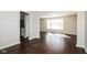 Bright living room featuring hardwood floors and a large window, offering ample natural light at 5060 Staughton Dr, Indianapolis, IN 46226