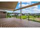 Spacious back porch features a covered area, perfect for outdoor relaxation and enjoying the backyard view at 5469 Harness Dr, Greenwood, IN 46143