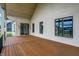 The covered back porch features brick accents and sliding door access, offering seamless indoor-outdoor living at 5469 Harness Dr, Greenwood, IN 46143