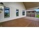 Covered back porch with brick and painted brick accents, offering a relaxing outdoor space at 5469 Harness Dr, Greenwood, IN 46143