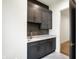 Dark gray cabinets, sink, and countertop area at 5469 Harness Dr, Greenwood, IN 46143