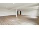 Large basement area with wood-look flooring, natural light, and modern lighting at 5469 Harness Dr, Greenwood, IN 46143