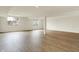 Unfinished basement offers ample open space, natural light, and wood-look flooring at 5469 Harness Dr, Greenwood, IN 46143