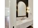 Modern bathroom with elegant mirror, marble countertop, and gold fixtures at 5469 Harness Dr, Greenwood, IN 46143
