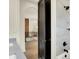 Bathroom shower with white tiled walls and a view of hallway at 5469 Harness Dr, Greenwood, IN 46143