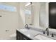 Bathroom featuring double vanity with framed mirrors and black fixtures at 5469 Harness Dr, Greenwood, IN 46143