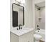 Bathroom featuring a vanity with black hardware, framed mirror, and tub shower combination at 5469 Harness Dr, Greenwood, IN 46143