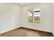 Bedroom featuring hardwood floors and a window overlooking the yard at 5469 Harness Dr, Greenwood, IN 46143