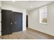 Spacious bedroom with wood-look flooring, large closet, and a bright window at 5469 Harness Dr, Greenwood, IN 46143