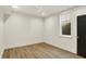 Bright bedroom with wood-look flooring, ceiling fan, and natural light from a window at 5469 Harness Dr, Greenwood, IN 46143