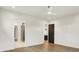 Spacious bedroom featuring hardwood floors with views to the bathroom and kitchen at 5469 Harness Dr, Greenwood, IN 46143
