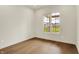 Well lit bedroom features hardwood floors and a large window at 5469 Harness Dr, Greenwood, IN 46143