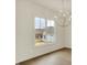 Bright dining room featuring a stylish chandelier and large windows at 5469 Harness Dr, Greenwood, IN 46143