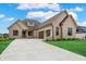 Stunning home with painted brick, black trim, and a spacious two-car garage at 5469 Harness Dr, Greenwood, IN 46143
