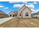 Charming painted brick home with black trim and modern architectural details at 5469 Harness Dr, Greenwood, IN 46143