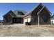 New construction, brick home featuring an attached two car garage and modern window designs at 5469 Harness Dr, Greenwood, IN 46143