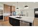 Open kitchen featuring a large island and views of the dining and living areas at 5469 Harness Dr, Greenwood, IN 46143